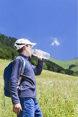 13-year-old hiker drinking some water to the bottle France