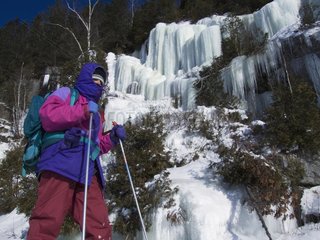 Ski touring near a fozen waterfall Quebec Canada