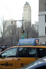 Advertising on a taxi and buildings in New York