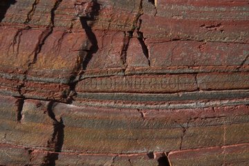 Layers of red clay in volcanic formation - Brittany France
