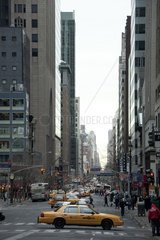 Traffic and crowds on Fifth Avenue in New York