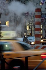 Traffic and smoke venting in a street in New York