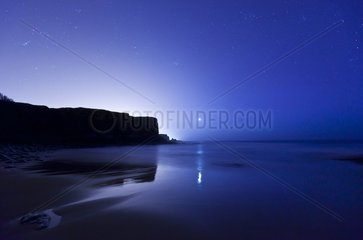 Moon on the Arnillas beach Bay of Biscay Spain