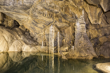 Water partially covers ground stalactites and stalagmites which makes it seem like they are growing out of the water at Venice Pier  Krizna jama  cave where remains of over 100 Cave bears (Ursus ingressus) have been found  Blo?ka polica  Slovenia