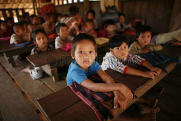 Closeup of children in a crowded schoolroom in La Per Her. In Myanmar (Burma)  thousands of people have settled near the border as a result of oppression in their homeland. Around 200 Burmese displaced people have settled in La Per Her  a village on the B