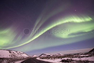 Aurora borealis on volcanic desert in winter - Iceland