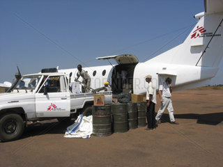 An MSF team unloads supplies onto a waiting truck in Angola. Feeding centres and other humanitarian aid were organised in Angola after widescale malnutrition during and following the countrys civil war.