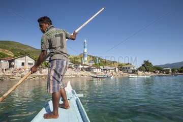 Man directing his boat - Lamakera Solor Island Indonesia