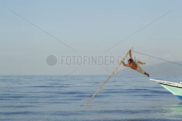 Fisherman throwing harpoon on Manta ray - Solor Indonesia