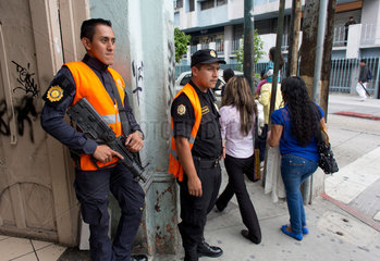 police officers guarding the street of guatamala city