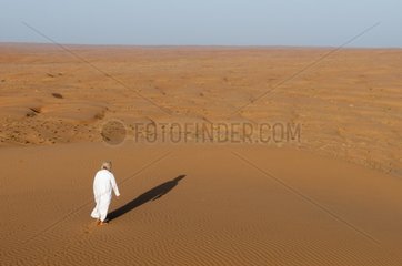 Omani man on a dune at Wahiba Sands Desert - Oman