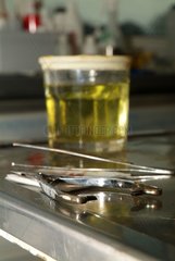 Grip and bottle on an operating table in a veterinary surgeon