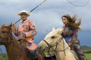 Mongol on a horse  with a catch lasso  Zhangjiakou  Bashang Grassland  Hebei Province  Inner Mongolia  China