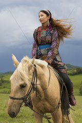 Mongolian woman with her horse  Bashang Grassland  Zhangjiakou  Hebei Province  Inner Mongolia  China