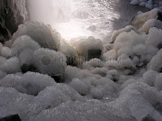 Cascade of Deroc under the ice with Aubrac in winter