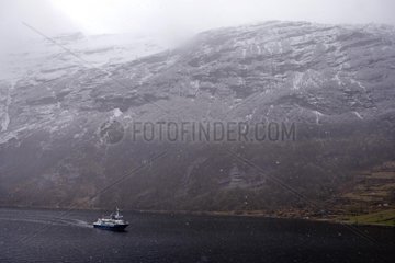 Cruise boat in the Geirangerfjord in winter Norway