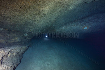 Diver in an underwater cavity. Mayotte