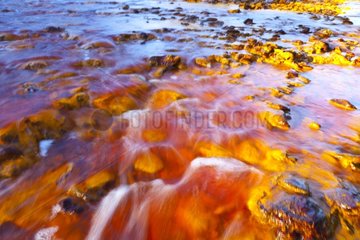 Red water Iron loaded in the Rio Tinto Andalusia Spain