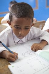 Schoolboy in a classroom Iboih Pulau Weh Sumatra