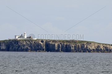 Lighthouse above the cliffs Farne Island UK