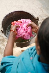 Washing of plastic bags collected in the street India