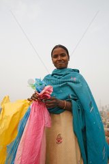Woman with plastic bags for recycling India