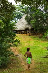 Embera woman walking in a Village Chagres NP Panama