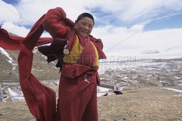 Young monk on the heights of Serxu Kham area China