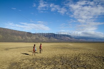Masai on the dry banks of Lake Natron Tanzania