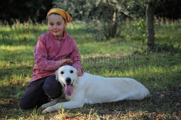Girl and dog in the grass - France