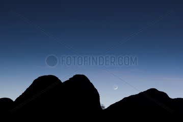 Moon and Bungle Bungles rock formations at dawn Australia