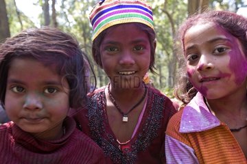 Children with colourful face at a holy festival India