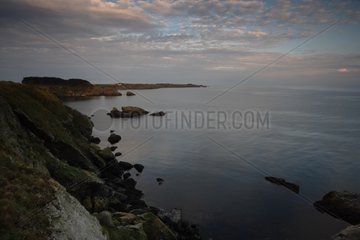 Rocky coast of Belle Ile en Mer at twilight France