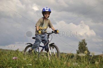 A boy with mountain bicycle