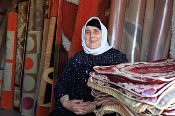 Old woman selling carpets Shkoder in Albania