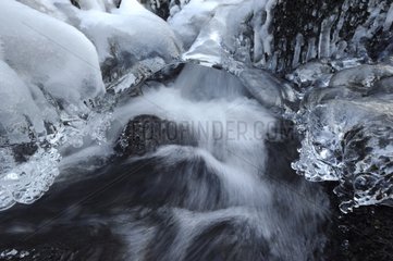 Ice on the river in the Vosges mountains in winter