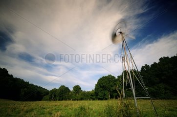 Windmill water pump in a field Normandie France
