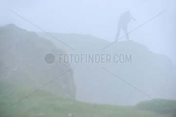 Silhouette of a photographer in the fog Scotland