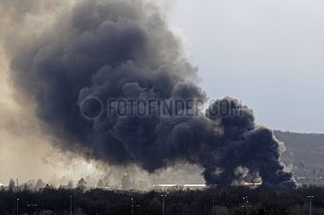 Smoke from a fire in a warehouse trucks France