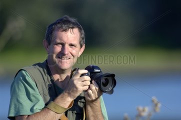 Portrait of a photgraphe in full action