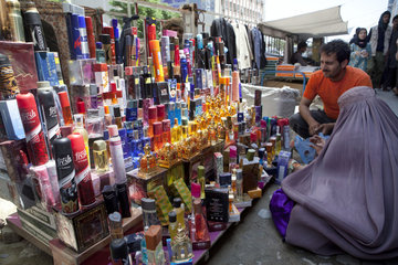 woman buying parfum in kabul