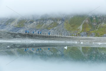 Tourists on the shore - Spitsbergen Svalbard Bellsund