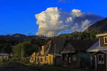 Chaiten volcano in activity and town of Chaiten - Chile