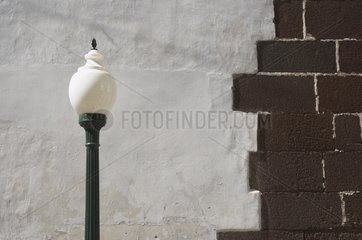 Standard lamp and wall of the Cathedral of Funchal Madeira