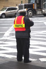 Woman regulating road traffic in Soho New York
