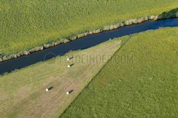 Air shot of the Sarre bordered by meadows France
