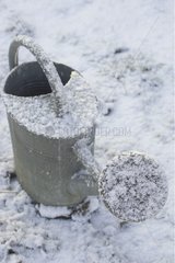 Zinc watering covered with snow in winter