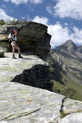 Hiker on a rock in Servizio Pass Italy