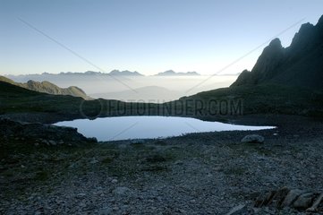 Small mountain lake at twilight Lombardy Italy