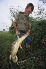 Bill Howell and Alligator at bait Texas USA